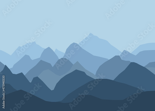 Landscape with blue misty silhouettes of mountains