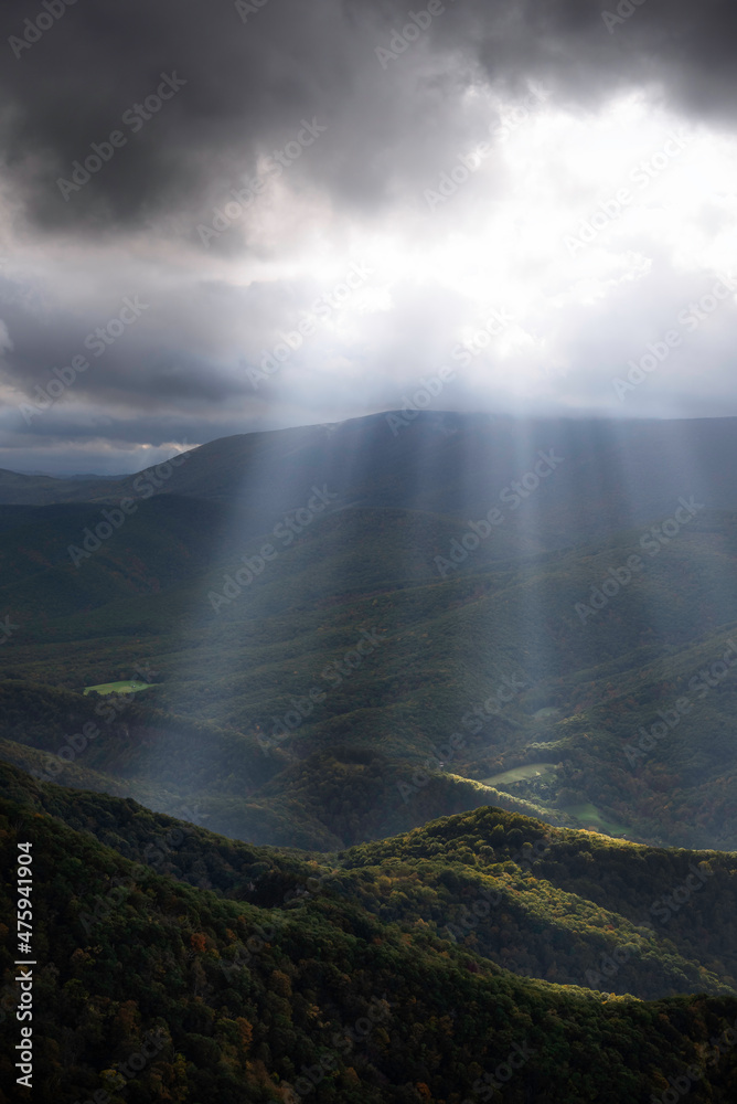 An intense display of crepuscular rays of light illuminating down into the North Fork Valley of West Virginia as storm clouds moved off of the Allegheny Front to the west. An intense display of crepuscular rays of light illuminating down into the North Fork Valley of West Virginia as storm clouds moved off of the Allegheny Front to the west.