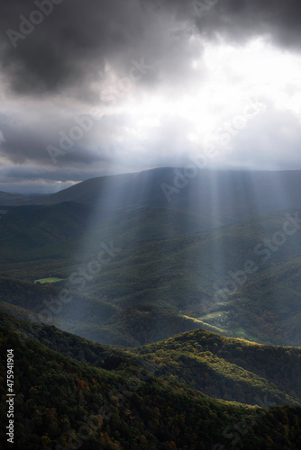 An intense display of crepuscular rays of light illuminating down into the North Fork Valley of West Virginia as storm clouds moved off of the Allegheny Front to the west.