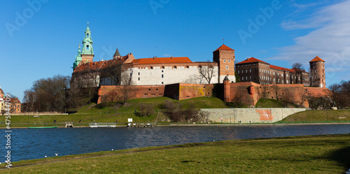 View of medieval Wawel castle on Vistula River at sunny spring day, Krakow, Poland photo