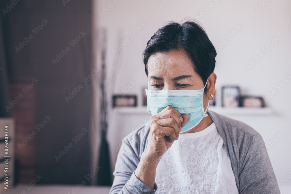 Senior asian woman coughing and sore throat at home