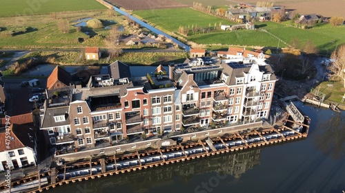 Harbor town on Goeree Overflakkee in the Netherlands with the residential area around the newly constructed harbour. Traditional new construction.