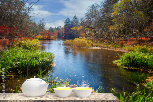 3d rendering of Cup with tea and teapot with nice background photo