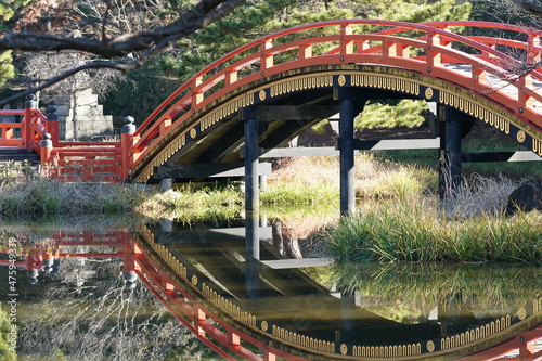 red wood bridge in the park