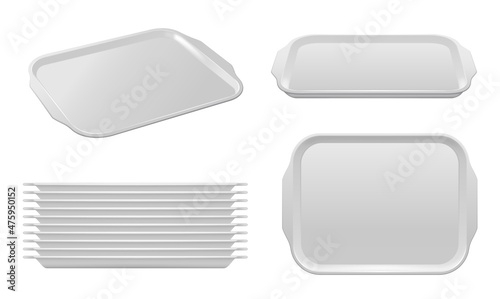 Isolated food plastic tray vector mockup of white blank fast food trays with handles. Pile of empty realistic containers, plate or rectangle platter for meal serving, canteen or restaurant trays photo