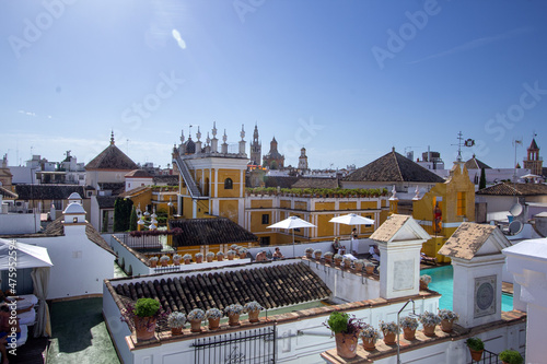 Seville, Spain - Sept. 9, 2013: Rooftop view of Hotel Las Casas de la Judería, made up of 27 traditional Sevillan houses, connected by passages and courtyards.is located in Seville’s Santa Cruz. photo