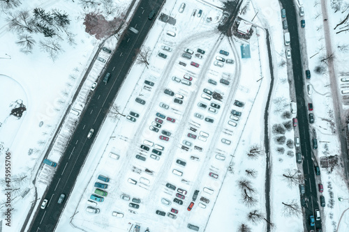 parking lot at winter season with snow-covered cars. aerial photography with drone. © Mr Twister