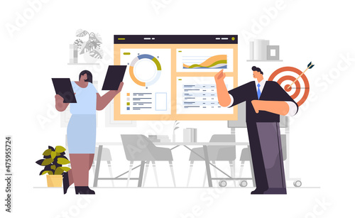 businesspeople presenting financial statistics charts graphs and diagrams at conference meeting presentation concept