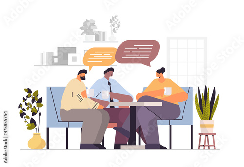 businesspeople drinking coffee and discussing during meeting chat bubble communication brainstorming coffee break