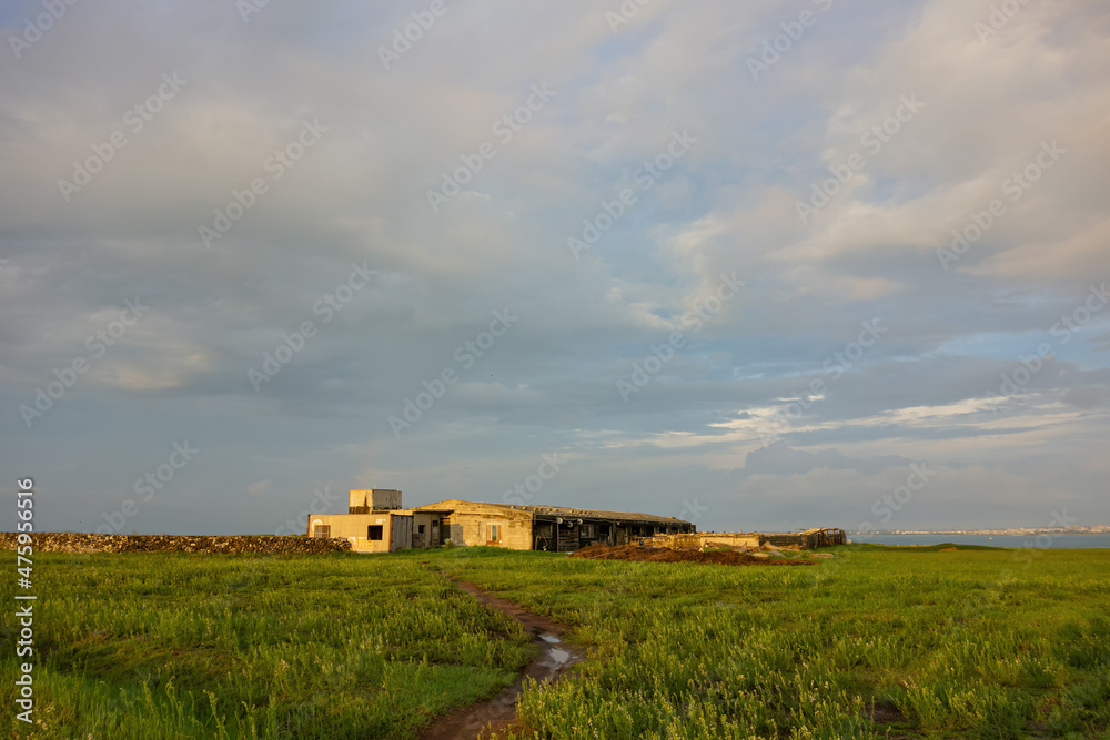 Sunset with a farm building at Penghu island Sunset with a farm building at Penghu island
