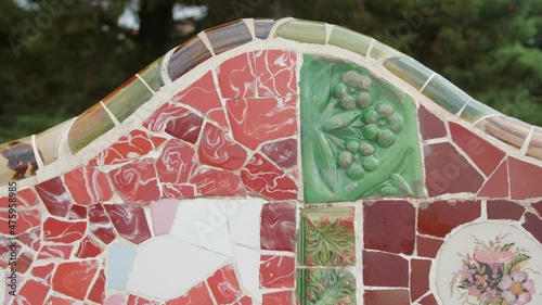Colorful Tiled Mosaic Bench At The Main Entrance Of Park Guell In Barcelona, Spain. - close up, slider