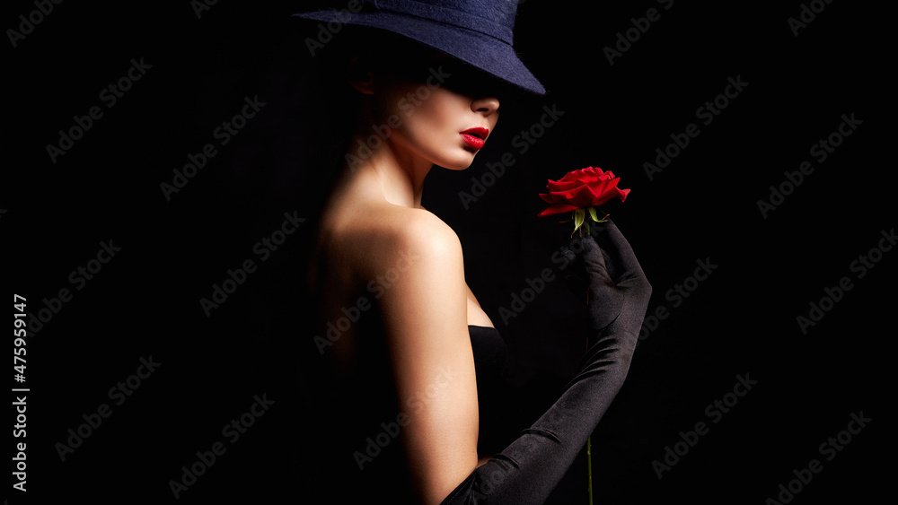 Fototapeta premium Beautiful young Woman In Hat and Flower. Lovely girl weared gloves