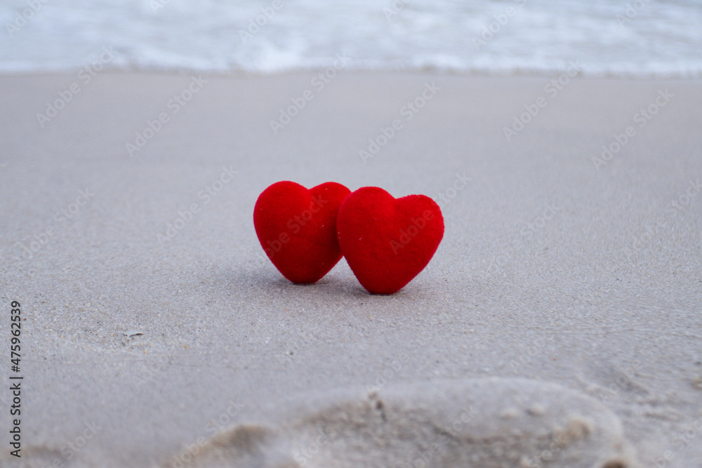Red heart on a sandy beach concept Valentine day Red heart on a sandy beach concept Valentine day