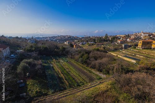 Views from former train track between Trieste and Kozina, above valley of Glinscica or Rosandra on a sunny winter day. View of city of trieste below photo