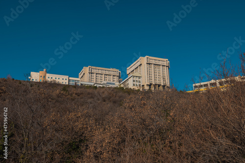 Iconic houses above the trieste, looking from former train track between Trieste and Kozina on a sunny winter day. photo