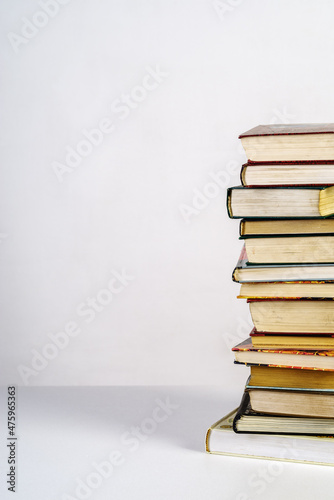Принти на полотні Stack of old books on white background
