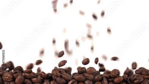 coffee beans fall in slow motion and cover the whole screen