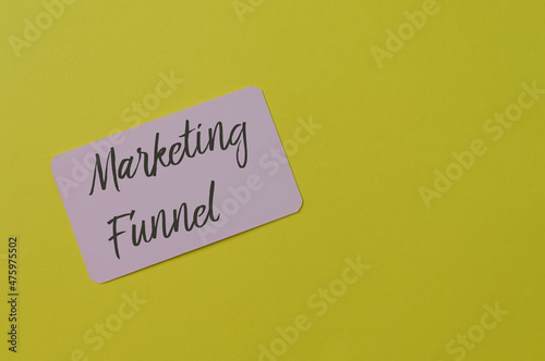 Pink card written with text MARKETING FUNNEL