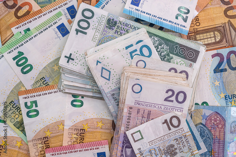 pile of polish banknotes zlotys and euros pile of polish banknotes zlotys and euros