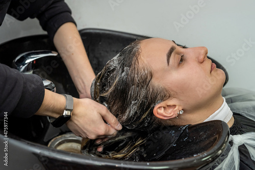 in beauty salons, qualified masters wash their heads before hair treatments.