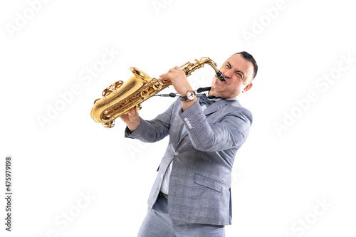 Expressive musician man in a suit plays on saxophone isolated on white background