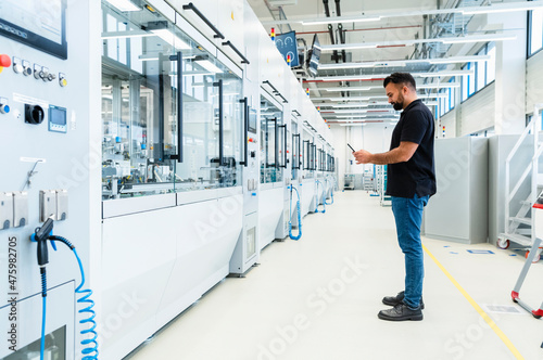 Engineer using mobile phone at electrical industry