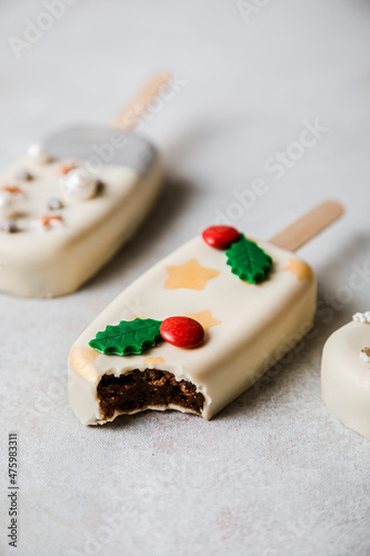 Christmas decorated cake pop with missing bite