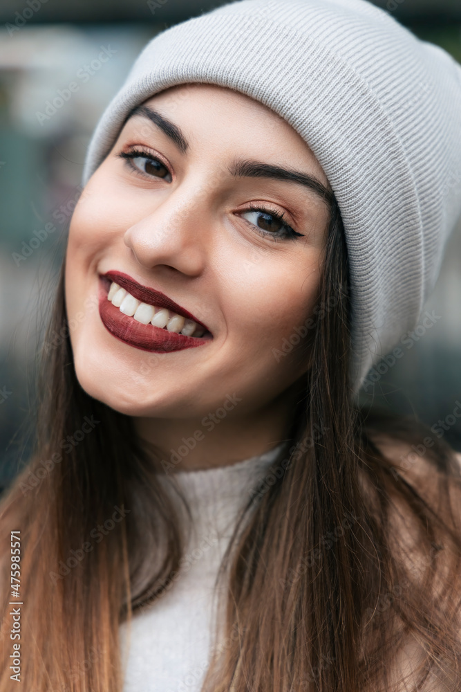 Beautiful woman smiling wearing knit hat Beautiful woman smiling wearing knit hat