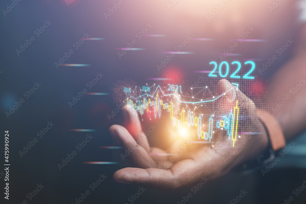Businessmen analyze business investments in this new year. Demonstrates the trends driving digital online shopping to develop future online businesses. 2022 concept
