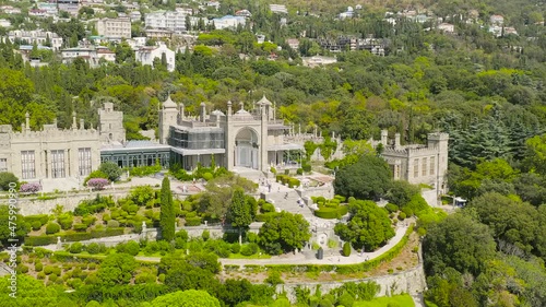 Alupka, Crimea. Vorontsov Palace. 19th century Gothic mansion with well-preserved halls and a picturesque 40 hectare park. The palace was built from 1828 to 1848, Aerial View Hyperlapse, Point of int photo