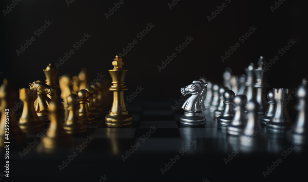 Chess board game silver team and gold team is strategy game as business challenge competitive game ,this business strategy plan concept. Chess board game silver team and gold team is strategy game as business challenge competitive game ,this business strategy plan concept.