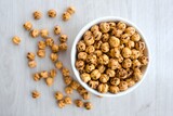 roasted chickpeas in a bowl on wooden table