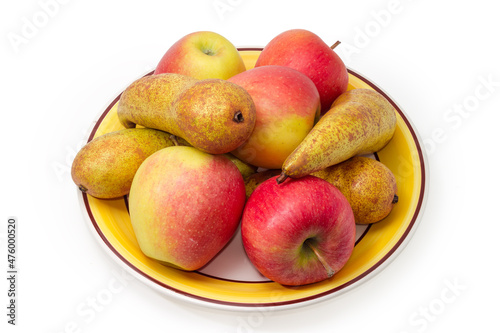 Pears of Bosc variety and red apples on a dish