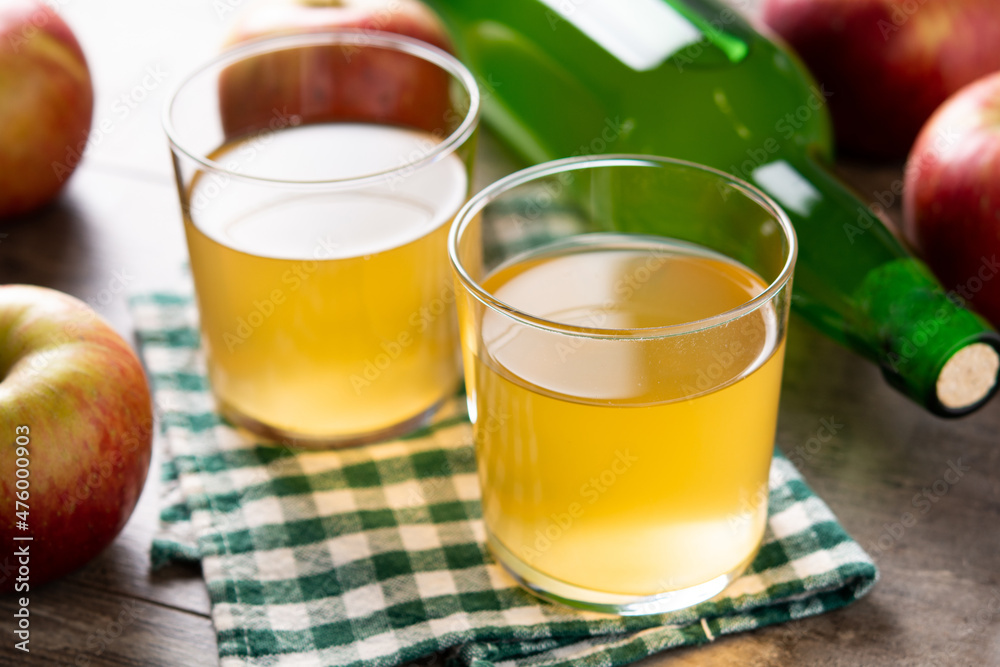 Apple cider drink on rustic wooden table. Apple cider drink on rustic wooden table.