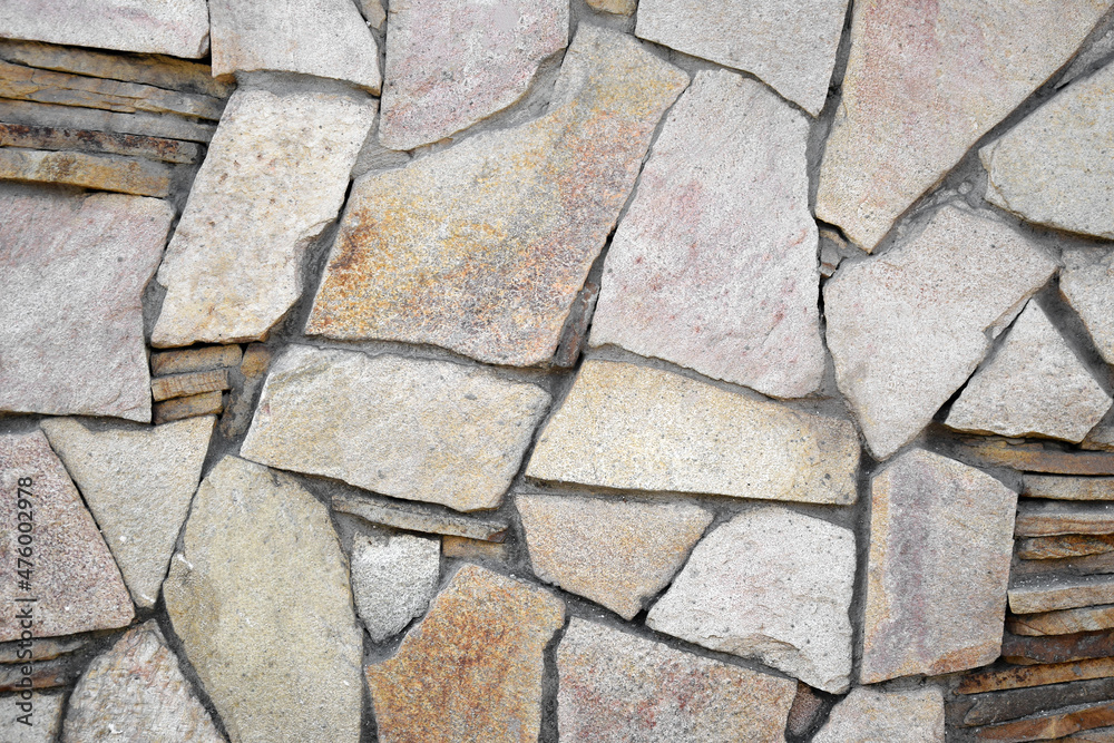 Obraz premium The light brown stone wall texture. Background.