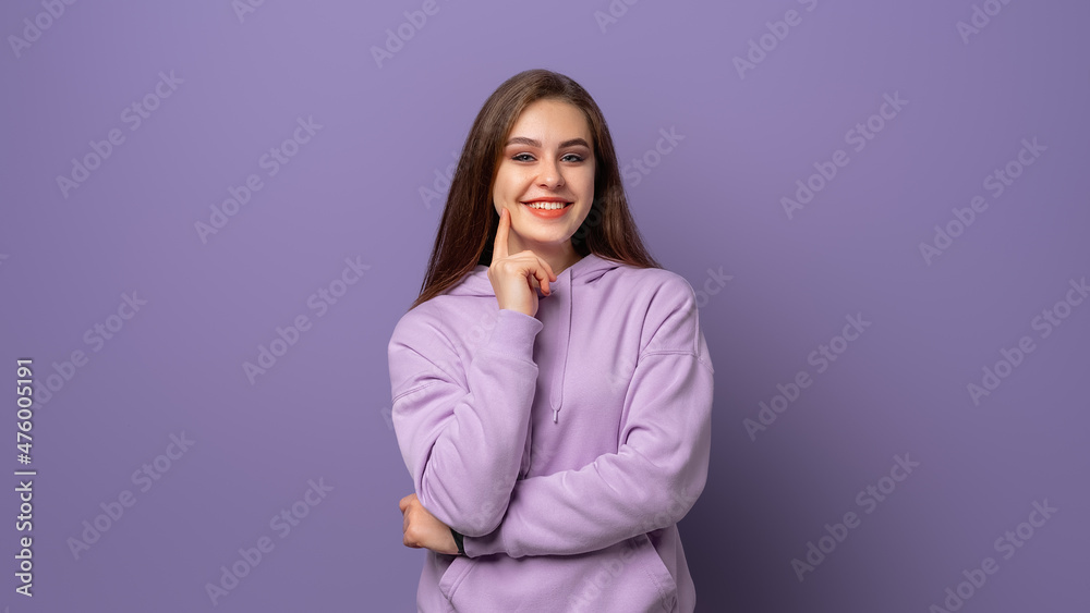 portrait of beautiful brunette young woman smiling cheerfully, showing her white teeth to camera while feeling happy and carefree on her first day-off portrait of beautiful brunette young woman smiling cheerfully, showing her white teeth to camera while feeling happy and carefree on her first day-off