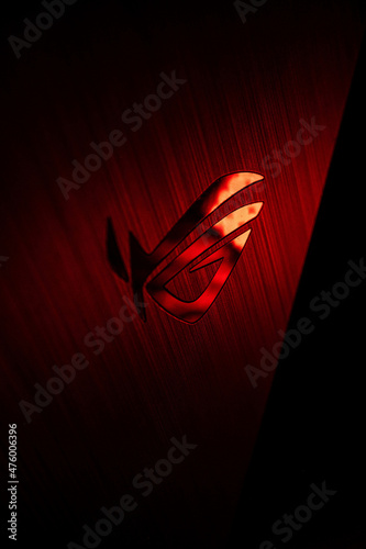 Scenic shot of the logo of ROG Asus, hardware made for gamers, in red color in darkness photo