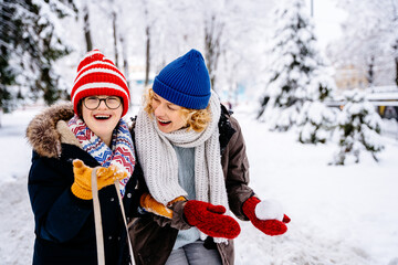 Happy family moments concept. A great walk a winter park has succeeded.