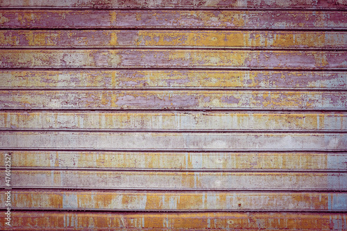 Obraz na płótnie Purple, violet, orange and blue old wooden texture background. Multicolor backdrop. Scratched weathered wooden wall with peeled off colorful paint close up. Horizontal wooden boards. Copy space w salonie