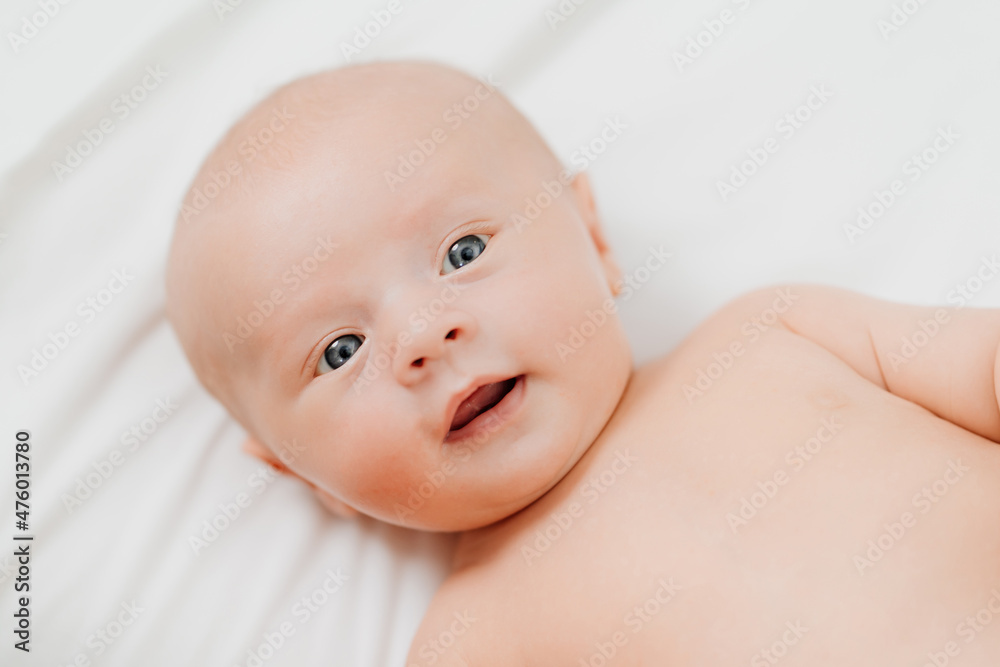 top view. cute baby on a white sheet. pediatrics top view. cute baby on a white sheet. pediatrics