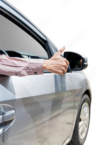 Man showing thumbs up from car window