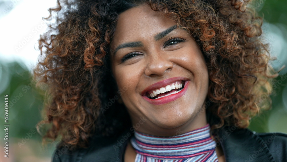 Joyful African woman smiling. Real life laugh and smile joyful emotion, diverse person Joyful African woman smiling. Real life laugh and smile joyful emotion, diverse person