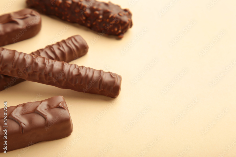Mix of chocolate bars on beige background. Top view. Mix of chocolate bars on beige background. Top view.
