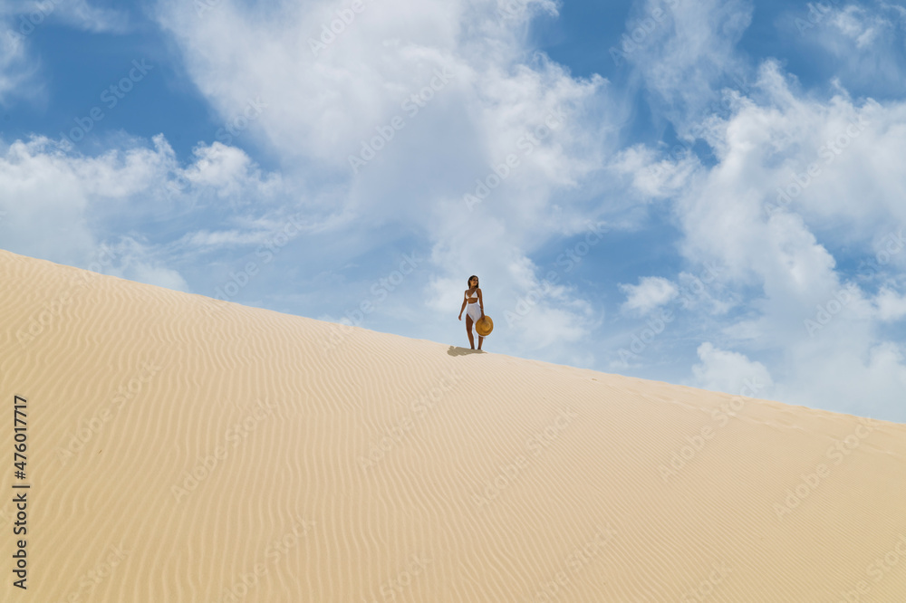 Woman in beachwear standing on beach