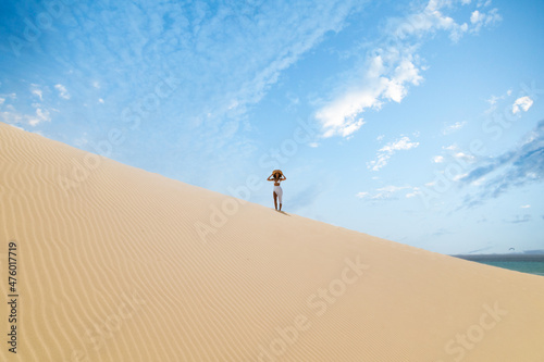 Woman in beachwear standing on beach