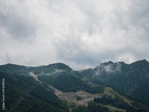 Beautiful green mountains and clouds in the resort of Rosa Khutor