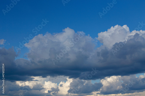 Close-up of huge white clouds and blue sky before rain. Rainy clouds
