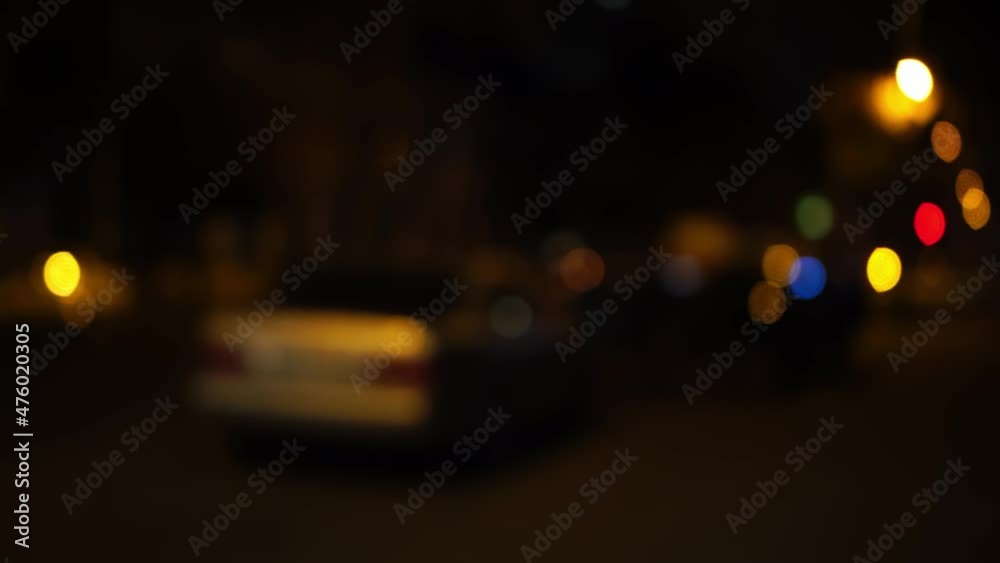 Unfocused red and blue car emergency lights at night in the city. Unfocused red and blue car emergency lights at night in the city.