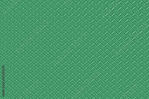 Green briar leather background with imitation weave texture. Glossy dermantine, artificial leather structure. photo