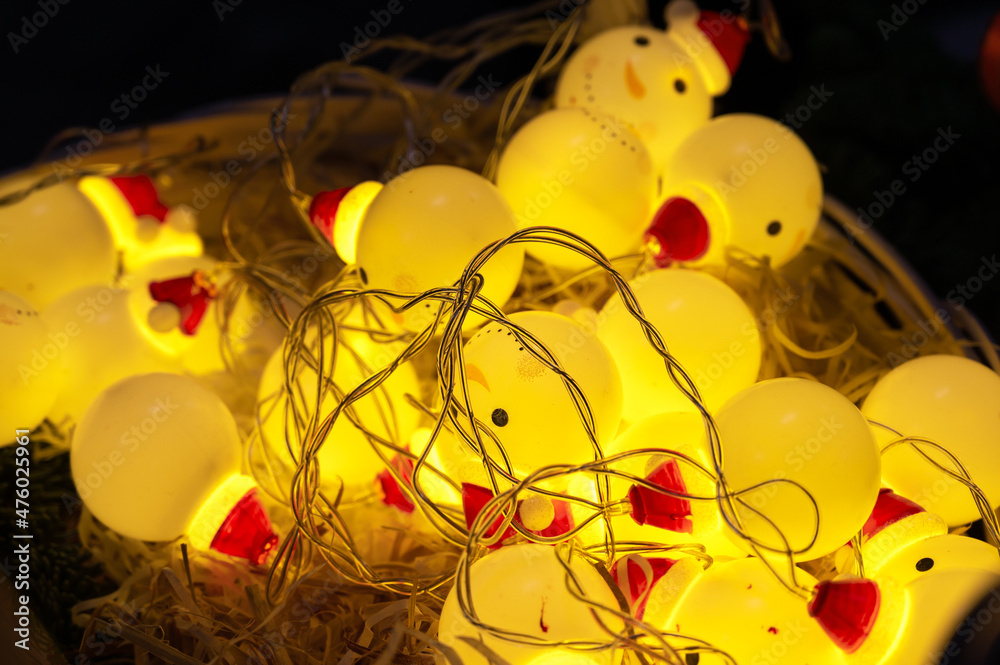 Handmade Christmas Garland in the Shape of Snowmen Made of Table Tennis Balls.